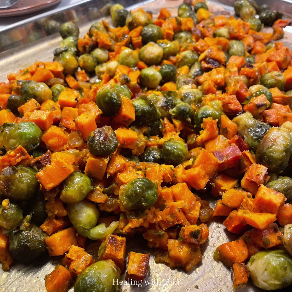 Sheet pan of roasted brussels sprouts and sweet potatoes, a simple AIP compliant elimination diet meal